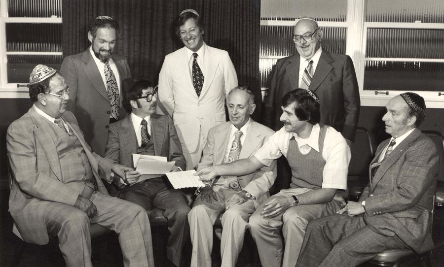 photo - Group of men with documents, State of Israel Bonds, Vancouver, B.C., 1970.