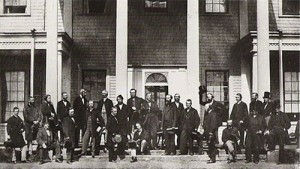 photo - Delegates from the legislatures of Canada, gathering on the steps of Prince Edward Island's Government House for the Charlottetown Conference in 1864