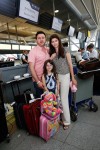 photo - The Babani family at New York’s JFK airport, moments before they boarded the plane to Israel