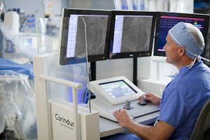 photo - The robotic catheterization system allows the doctor to open heart blockages and implant stents in patients remotely