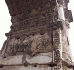 photo - The Arch of Titus remains standing in Rome today. Built in 81 CE, it depicts the triumphal procession of enslaved Jews and Temple spoils, including the Menorah, whose ultimate fate is unknown
