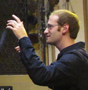 photo - YMCA Jerusalem Youth Chorus founder and conductor Micah Hendler
