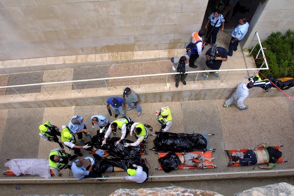 photo - Bodies are taken away following an explosion at the cafeteria of Jerusalem’s Hebrew University on July 31, 2002. Hamas took responsibility for the bombing, which killed seven people and wounded 70, but a new U.S. federal court ruling found the Palestine Liberation Organization and the Palestinian Authority liable for that attack and other committed during the second intifada