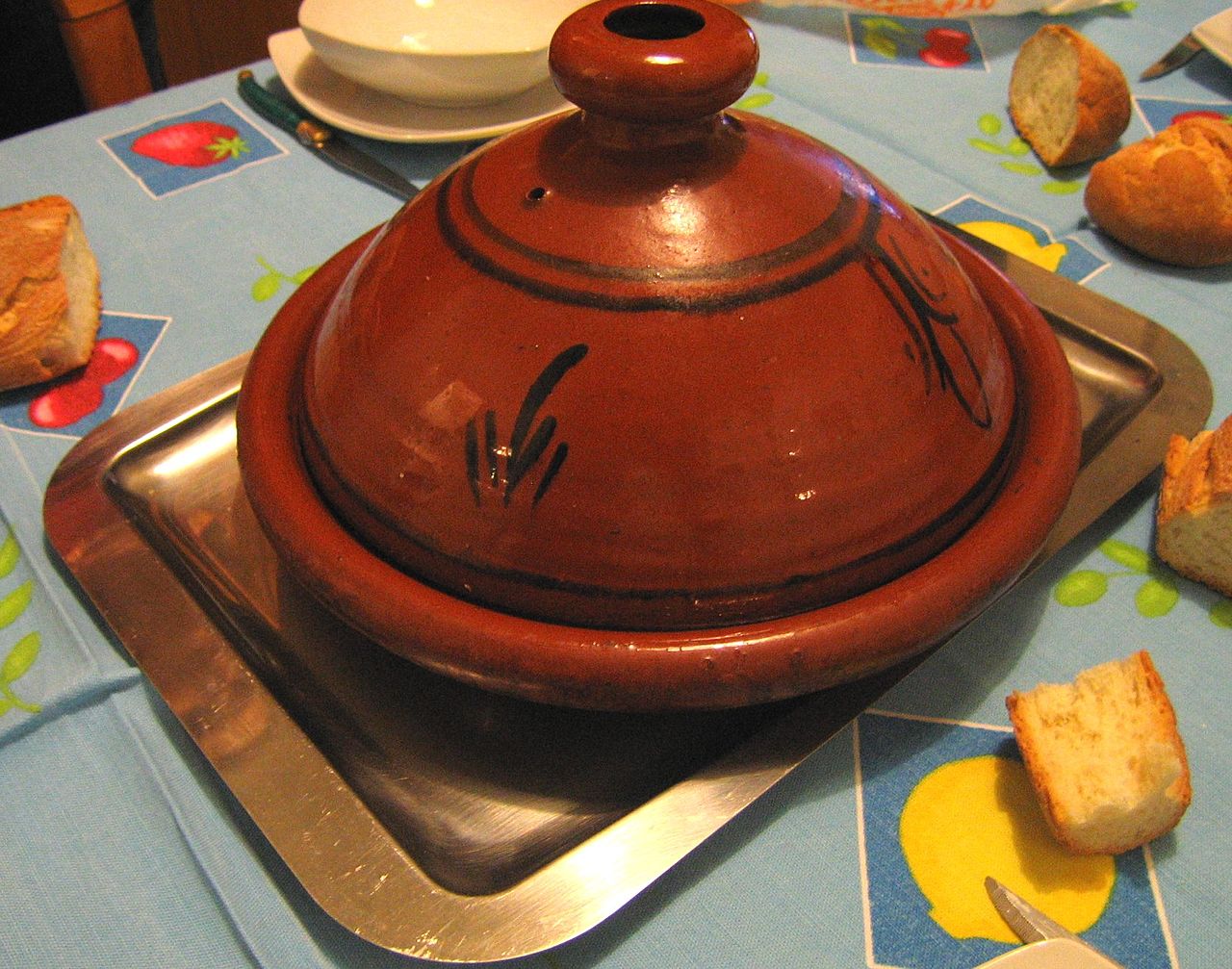photo - A tagine is a North African, slow-cooked savory stew, named after the earthenware clay pot in which it is cooked