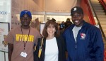 photo - Ruth Hoffman with baseball player Arthur Lusala, left, who today studies developmental economics at university, and coach George Mukhobe