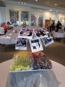 photo - At each table, there were photos of those who inscribed a letter in the Torah