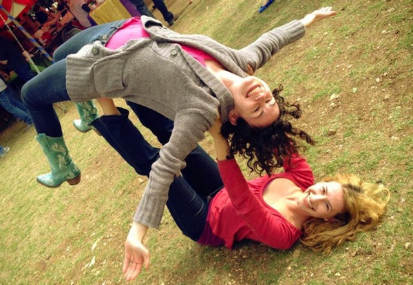 photo - Jerusalem-based instructor Ayo Oppenheimer bases student Rabbi Rachel Kobrin in her first acro-yoga flight