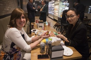 photo - Ruth Erlichman, left, with Ai Nakano, make origami cranes to be sold at another fundraiser