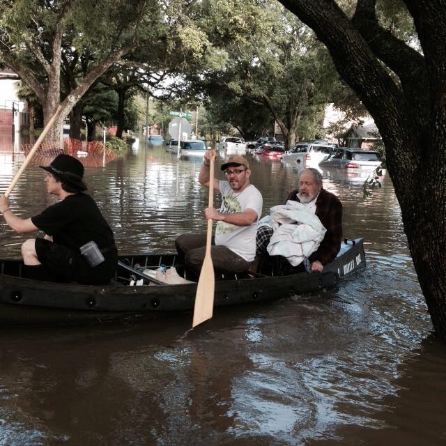 photo - Daniel Ogorek and Morgan Davis rescue Rabbi Emeritus Joseph Radinsky in a canoe.