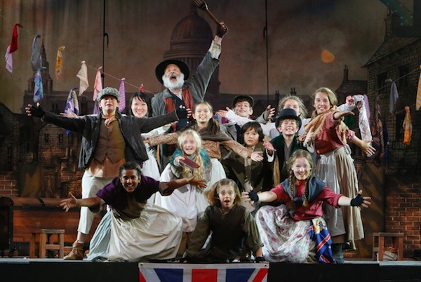photo - Stephen Aberle as Fagin, Carly Ronning as Oliver (centre, on floor) and the young cast of Oliver!