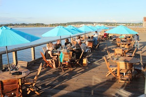 photo - Patio dining at sunset just outside Packers sports bar