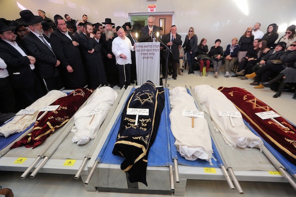 photo - On March 22, Gabriel Sassoon from New York eulogizes in Jerusalem his seven children who were killed in a house fire the previous Shabbat in Brooklyn.