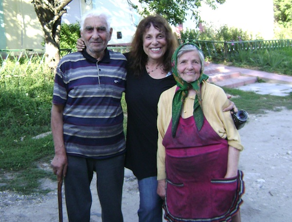 photo - Survivor Mitzvah Project’s Zane Buzby, centre, in 2012 with Abramas and Malka Dikhtyar, the last two Jews in Bazaliya, Ukraine, the birthplace of Buzby’s grandfather