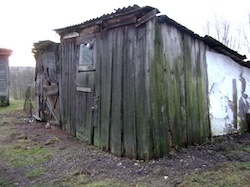 photo - Some survivors are living in huts – “no running water, no heat, broken windows.”