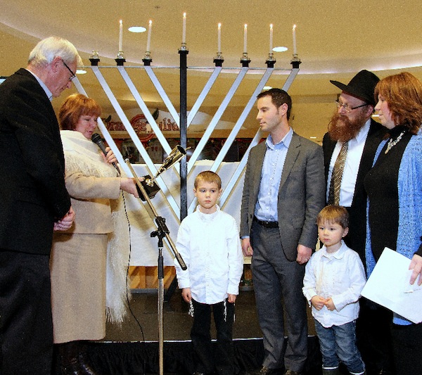 photo - Yosef Nider, centre, receives the inaugural Lamplighter Award last year
