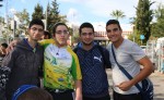 photo - Classmates congratulate Oz Attal, second from the left, after he completed Alyn Hospital’s Wheels of Love bike-a-thon