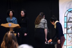 photo - Dr. Orly Salama-Alber, left, and Hannah Faber sing “Mi Ha’Ish,” while Cheryl Noon, left, and Kaitlin Findlay light the second candle