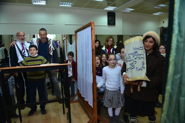 photo - Women at Zemer Hazayit return the Torah scroll to the ark