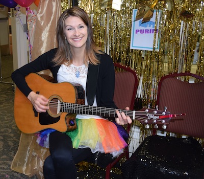 photo - Music therapist Megan Goudreau provides holiday entertainment