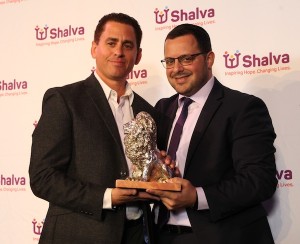 photo - Shai Gross, left, receives the Shalva Spirit of Hope Award from Avi Samuels, deputy director of Shalva