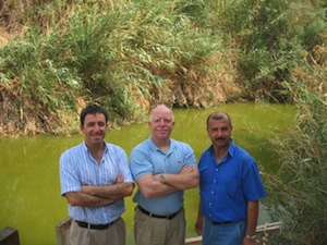 photo - The three co-directors of EcoPeace Middle East at the Jordan River. From left to right: Gidon Bromberg (Israel), Munqeth Mehyar (Jordan) and Nader Khateeb (Palestine)