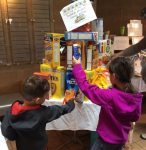 photo - During the seven weeks of the counting of the Omer to Shavuot, Temple Sholom’s religious school students bring donations of cereal for the Jewish Food Bank