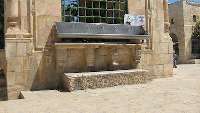 photo - The Mamluks’ Sabil Qaitbay (Fountain of Qayt Bay), located on the Temple Mount, was built in the 15th century. Note the contrast between the modern metal trough and the ornate Crusader stone door fixture used as a step