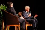 photo - Dr. Robert Krell, left, listens to Prof. Elie Wiesel, as Wiesel addresses the capacity crowd that came to the Orpheum in 2012 to hear him speak