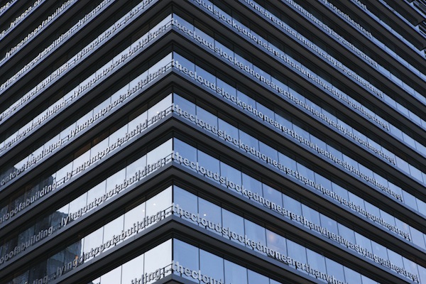 photo - “Lying on top of a building,” by U.K. artist Liam Gillick, wraps around 18 floors of the Pacific Rim Hotel in downtown Vancouver