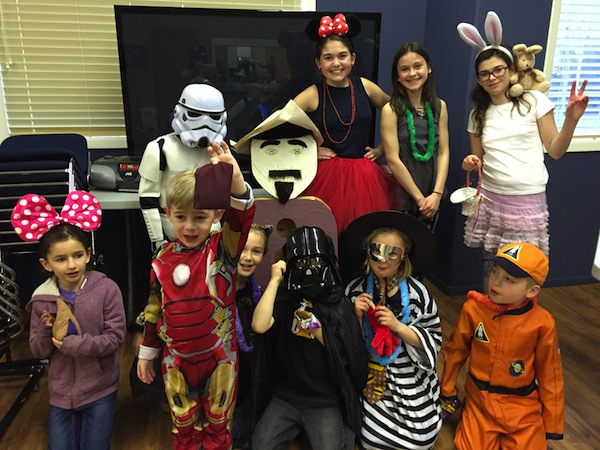 photo in Jewish Independent - Dressed for Purim, left to right: in the front row, Bria Tizel, Anderson Parnes, Kate Spevakow, Ryder Golbey, Skyla Golbey and Chase Golbey; in the back, Jordan Spevakow, Abbey Parnes and a friend, and Adarah Challmie