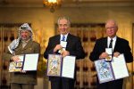 photo - The Nobel Peace Prize laureates for 1994 in Oslo, from left to right: Palestinian Liberation Organization chairman Yasser Arafat, Israeli foreign minister Shimon Peres and Israeli prime minister Yitzhak Rabin