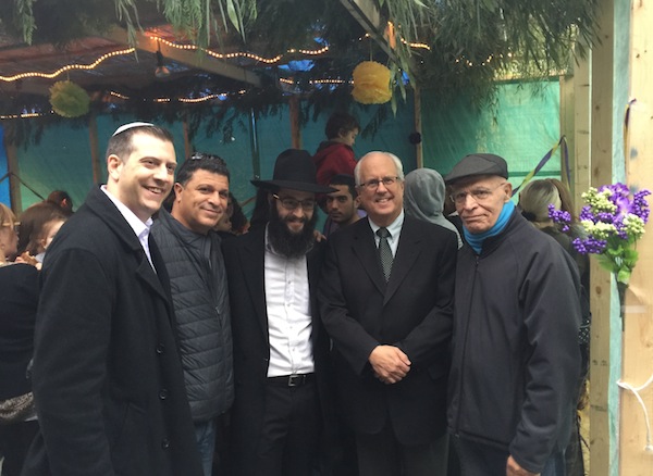 photo - On Oct. 19, Richmond Mayor Malcolm Brodie, second from the right, joined the Bayit’s celebration of Sukkot. He is pictured here with, from the left, Michael Sachs, Bayit president; Miki Fadida, sponsor of the Fadida Family Sukkah; Rabbi Levi Varnai, spiritual leader of the Bayit; and Moshe Fadida. The mayor discussed the local Jewish community, as well as some of the challenges facing young families