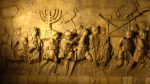 photo - When the Second Temple was destroyed, its menorah was said to have been taken to Rome. This is depicted, with the menorah being carried by Jewish slaves, in a carving on the inside of the Arch of Titus
