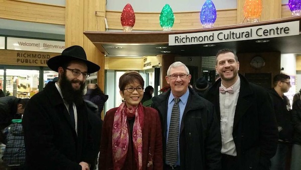 photo - Community leaders at the Dec. 26 menorah lighting in Richmond included, left to right, Bayit Rabbi Levi Varnai, MLA Teresa Wat, councilor Bill McNulty and Bayit president Michael Sachs