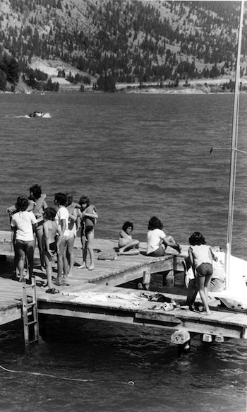 photo - Children on the dock at Camp Hatikvah, 1976. Though the writer’s camp experience occurred on a different continent and in a different generation, Jewish overnight camp changed her life