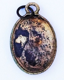 photo - The locket’s opposite side has the Shema printed on it