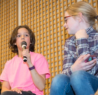 photo - Young audience members hoped to take what they learned at the forum about the immigrant experience and share it with those who could not attend the event