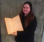 photo - Jewish Museum and Archives of British Columbia archivist Alysa Routtenberg holds a minute book from Victoria’s Congregation Emanu-El, circa 1920