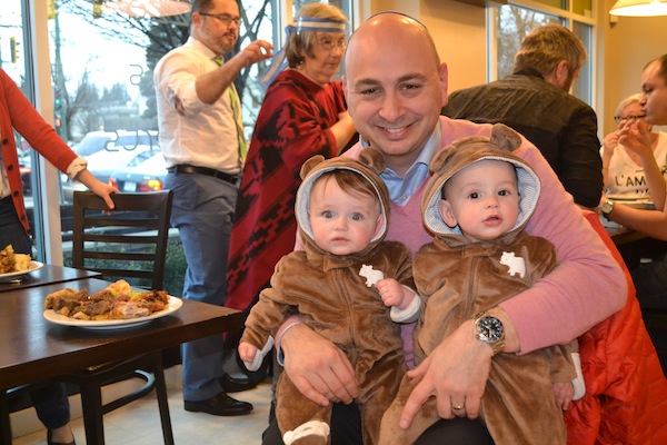 photo - Jewish Federation of Greater Vancouver chief executive officer Ezra Shanken with his nine-month-old twin boys at Café 41 for Purim