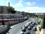 photo - Vehicles at a standstill alongside the ancient walls of Jerusalem’s Old City on April 24, as drivers honor the memory of the six million Jews who were murdered in the Holocaust. At 10 a.m., sirens sounded throughout Israel, and pedestrian and car traffic stopped to remember