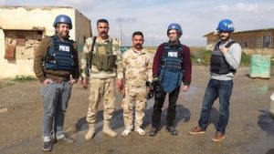 photo - Jesse Rosenfeld with peshmerga combatants, Santiago Bertolino and Ayar Mohammed Rasool