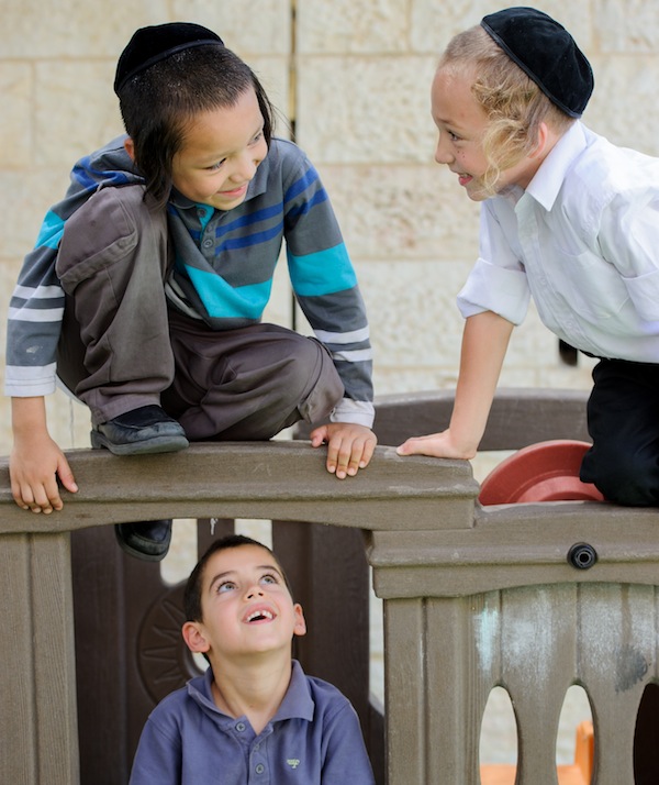 photo - This year, instead of seeing your children as a distraction from the path to spiritual preparation for the High Holidays, look to them to guide you towards a year of growth. (photo from IMP Group)