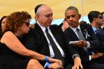 photo - September 2016, Jerusalem. At the funeral of former president and prime minister Shimon Peres, U.S. President Barack Obama offers a tissue to Peres’ son Chemi