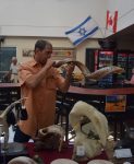 photo - Paul Harnett shows off his wares at the recent open house and market at the Jewish Community Centre of Greater Vancouver