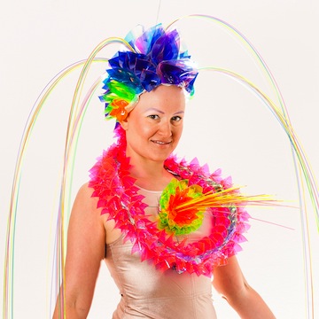 photo - Zula, wearing her own creation, which is on display at the Zack Gallery
