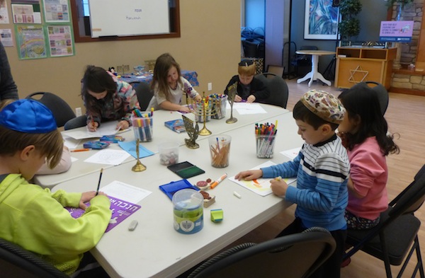 photo - White Rock / South Surrey Jewish Community Centre Religious School students work on their entries to the Jewish Independent’s annual Chanukah cover art contest