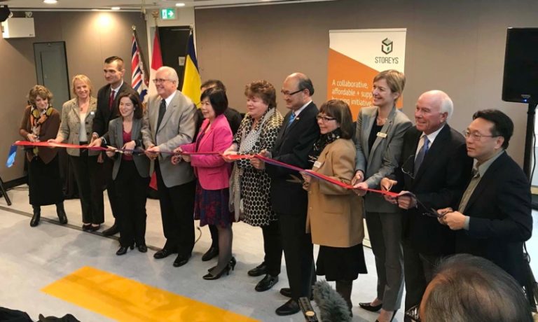 photo - Cutting the ribbon at the official opening of Storeys on Dec. 1