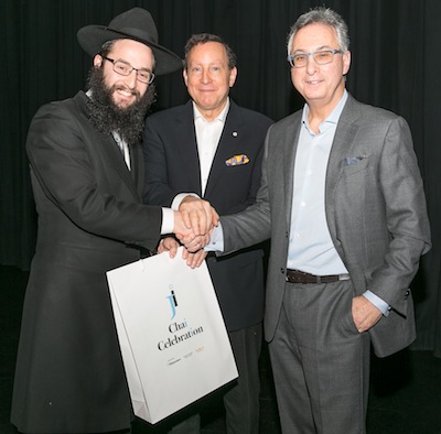 photo - JI’s 18 Under 36er Rabbi Levi Varnai, left, with JI Chai Celebration presenting sponsors Lorne Segal, centre, and Gary Segal