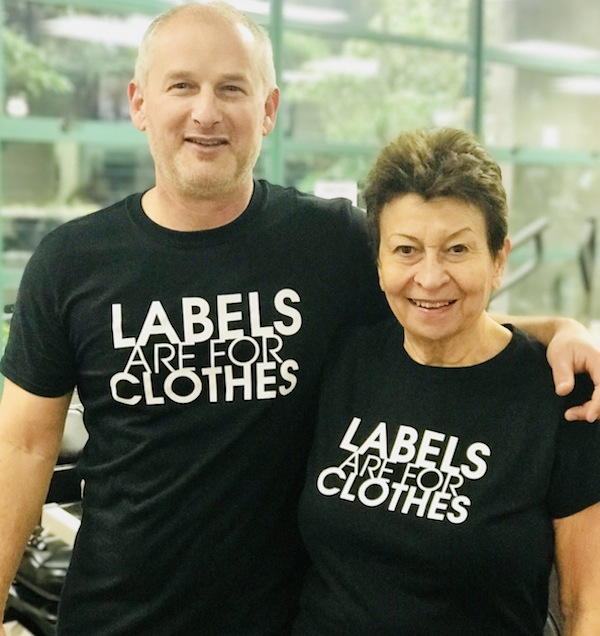photo - Eldad Goldfarb, executive director of the Jewish Community Centre of Greater Vancouver, and Jewish community member Shirley Barnett show off their “Labels are for Clothes” T-shirts