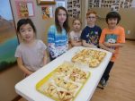 photo - In preparation for Purim, students of White Rock South Surrey JCC Religious School baked hamantashen to take home and share with their families
